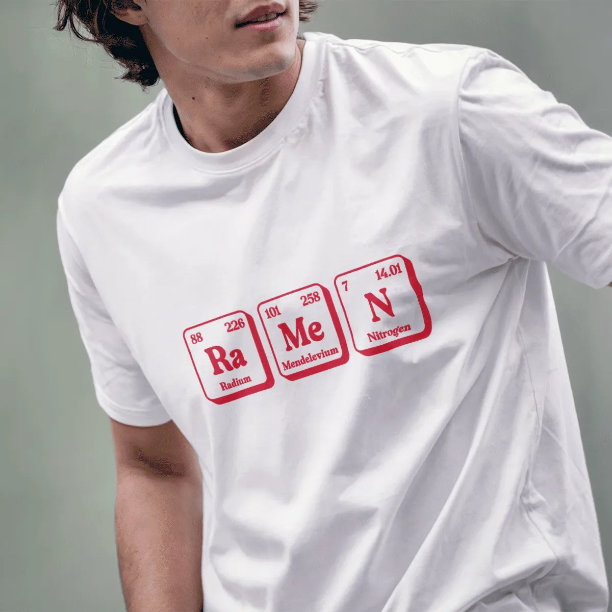Male model in white t-shirt with ramen periodic table design, modern japanese t-shirts style and fusion cuisine vibe.