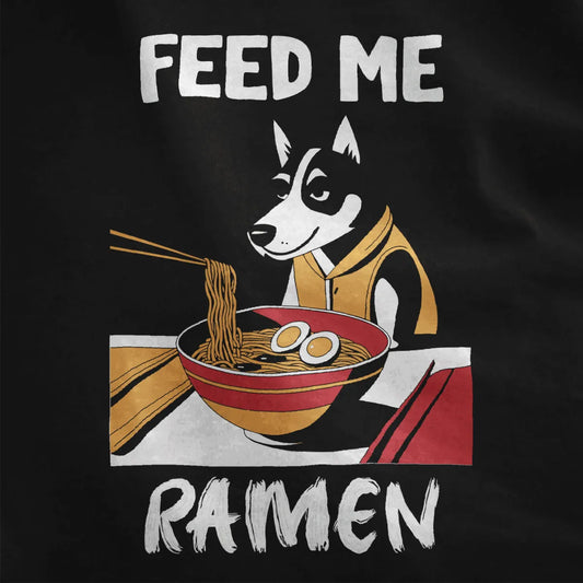 Closeup of husky in orange hoodie eyeing ramen bowl, “FEED ME RAMEN” text on black fabric, ramen t-shirt, dog shirt.