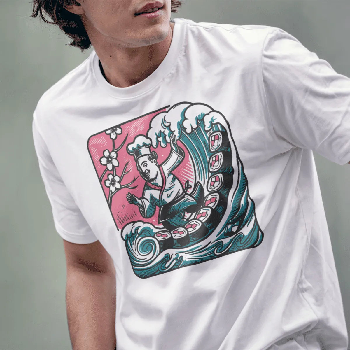 Male model in white t-shirt with chef riding artistic wave, surrounded by sushi and cherry blossoms.