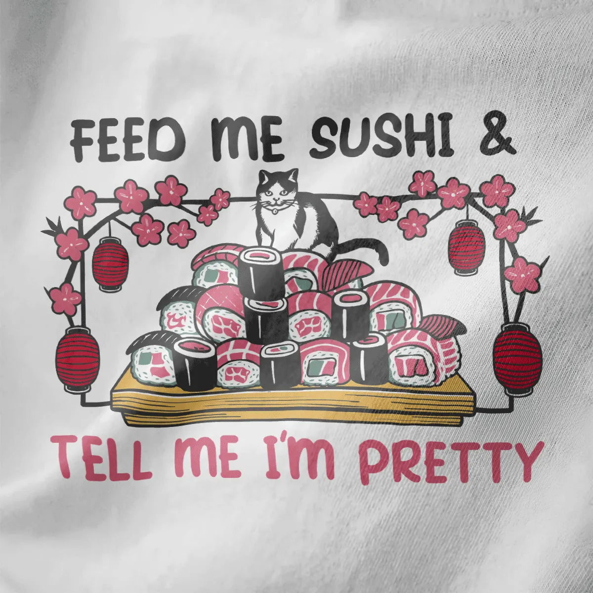 Black and white cat on sushi tray, bold "FEED ME SUSHI & TELL ME I'M PRETTY" text, white fabric, funny cat shirt.