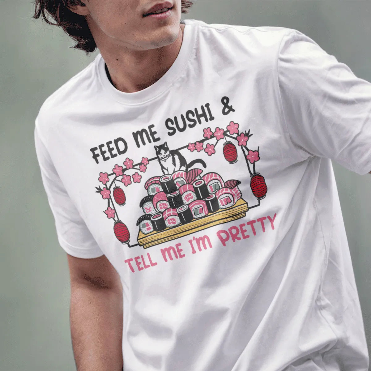 Male model in white t-shirt with cat sitting on sushi, funny cat shirt, kawaii sushi.