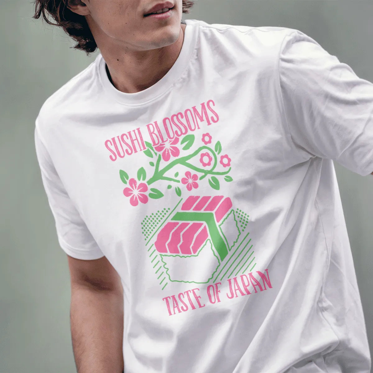 Male model in white t-shirt with sushi roll and cherry blossoms, japanese t-shirts, foodie style.