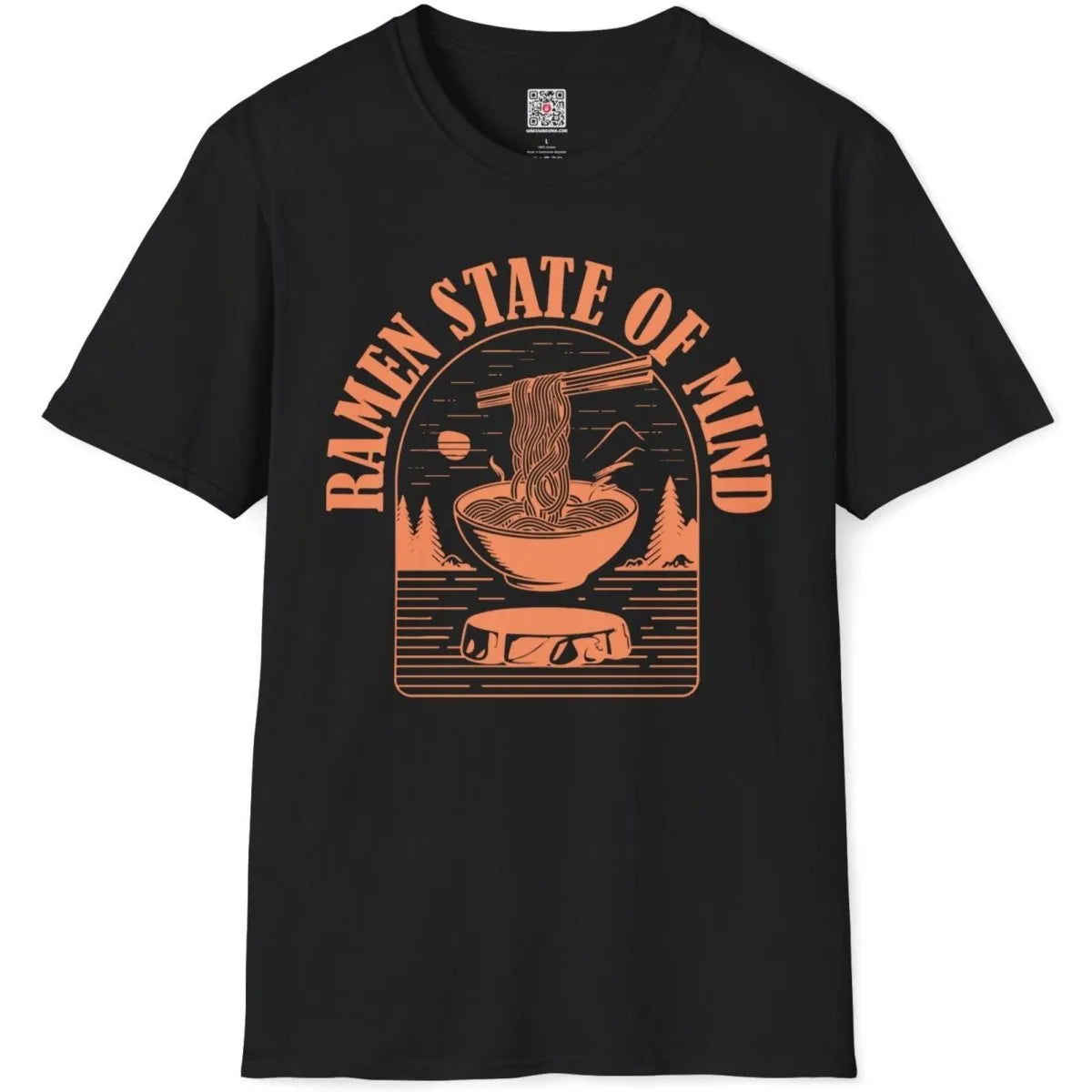 Black t-shirt flatlay with orange ramen bowl, pine trees, and mountain design, ramen t-shirt, ramen art.