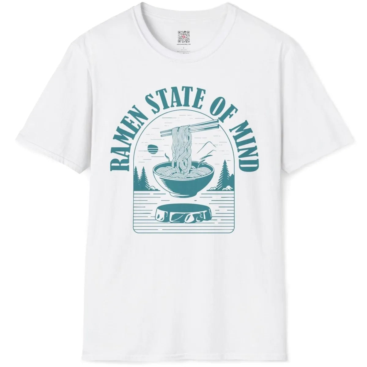 White t-shirt flatlay with teal ramen bowl, pine trees, and mountain, ramen t-shirt, ramen noodle clothing.