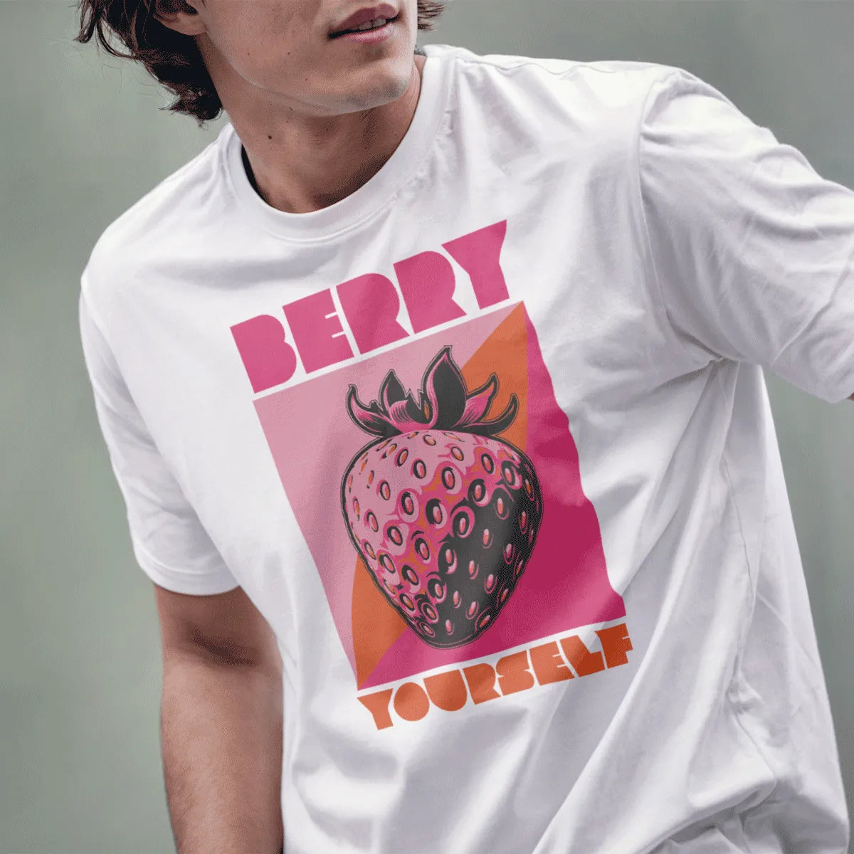 Male model in white t-shirt with playful strawberry pop art and bold text, japanese t-shirts, positive messaging.