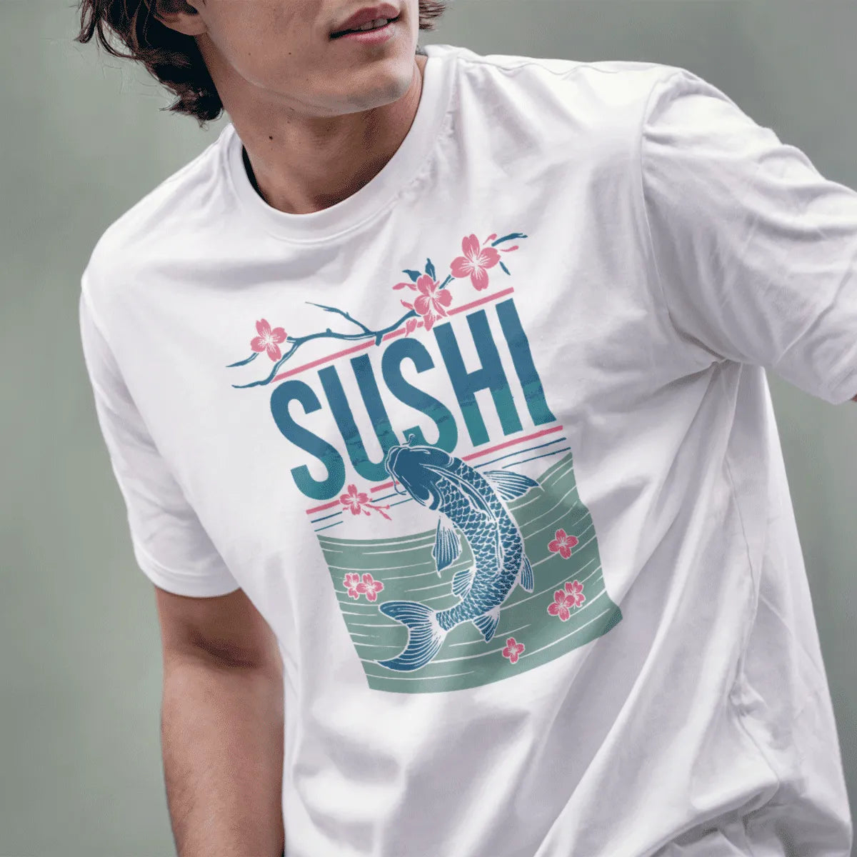 Male model in white shirt featuring SUSHI text, koi fish, and cherry blossoms; japanese t-shirts, graphic design t shirt.