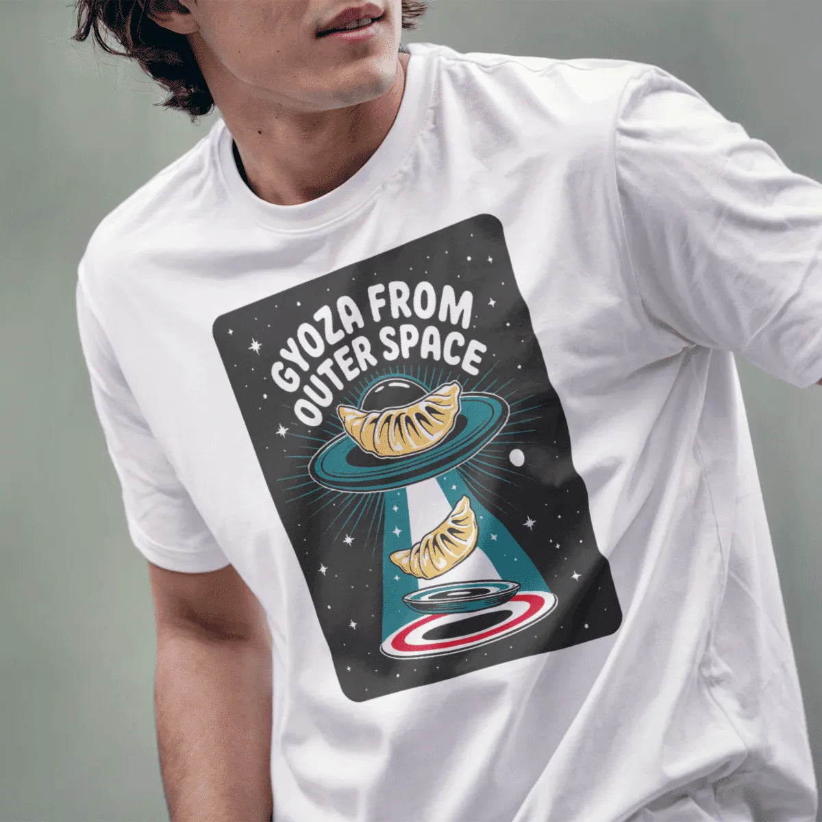 Male model in white t-shirt with playful gyoza from outer space, Japanese t-shirts style.