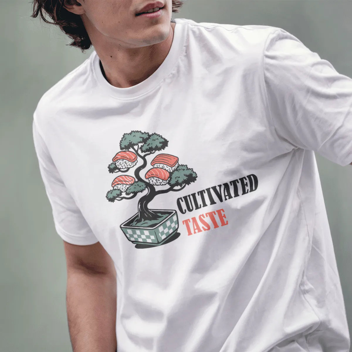 Male model in white t-shirt with bonsai tree, sushi, and bold modern text, sushi t-shirt, japanese t-shirts.