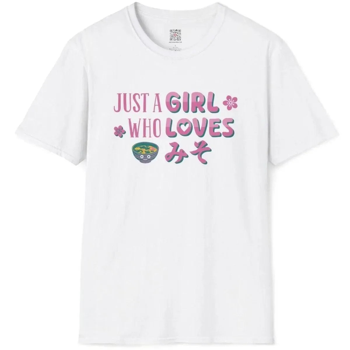 White flatlay of miso shirt with playful Japanese style cartoon, pink and teal lettering, and smiling miso bowl.