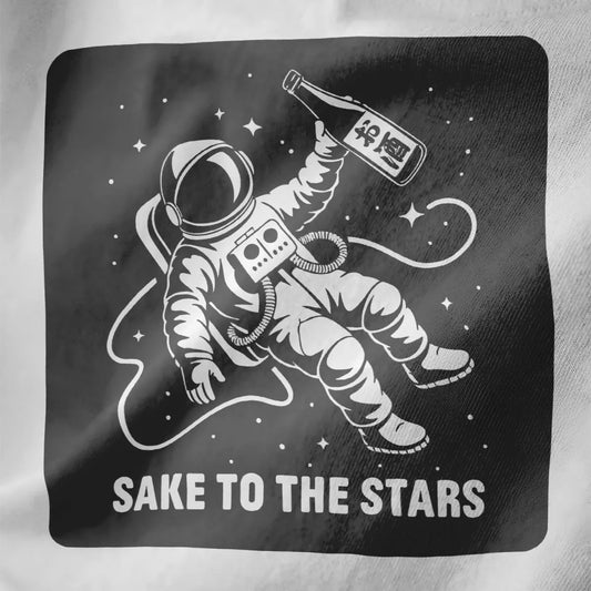 White fabric close-up of astronaut with sake bottle in space, bold "SAKE TO THE STARS" text, japanese t-shirts, space shirt.
