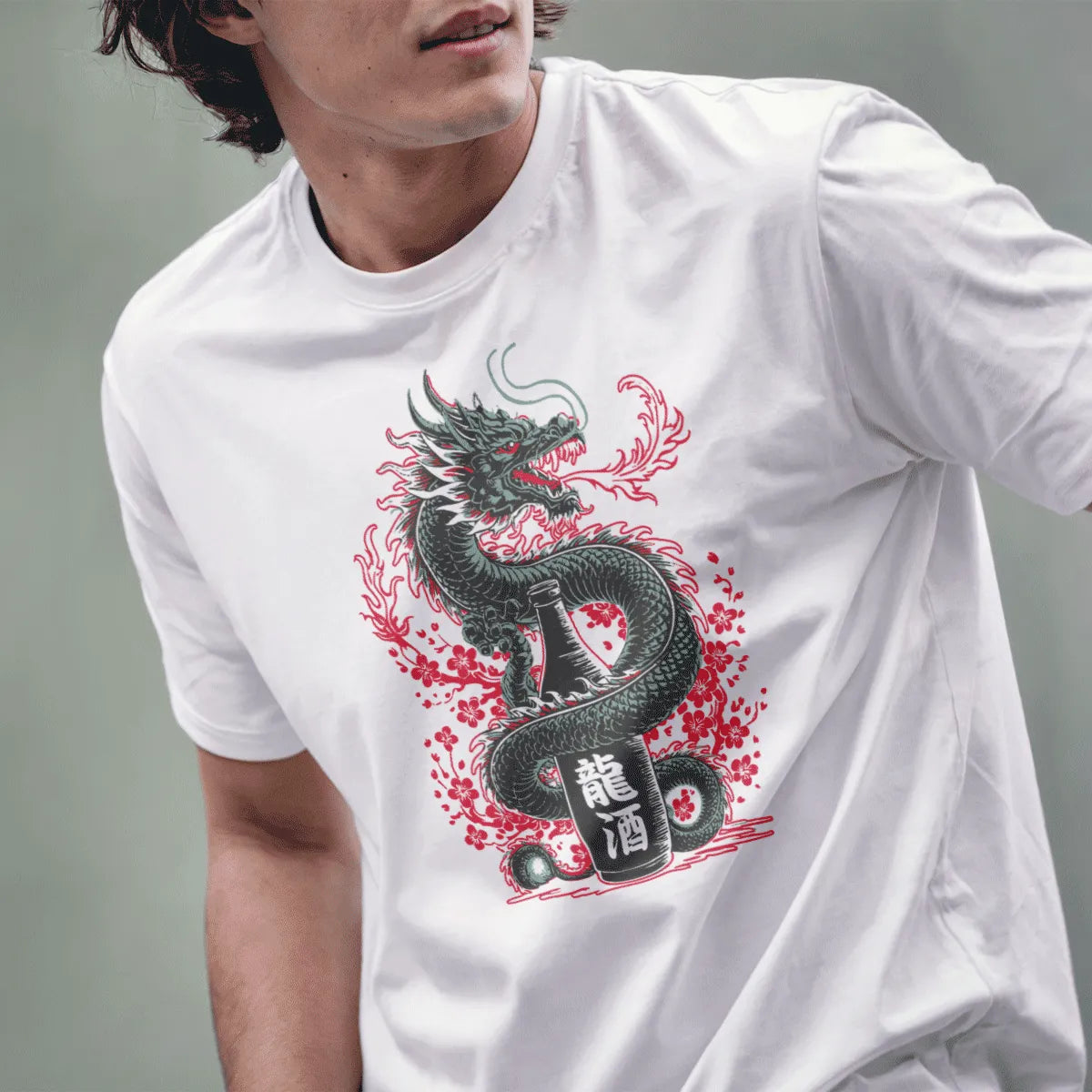 Male model wears white t-shirt with Japanese dragon, sake bottle, and cherry blossom art.