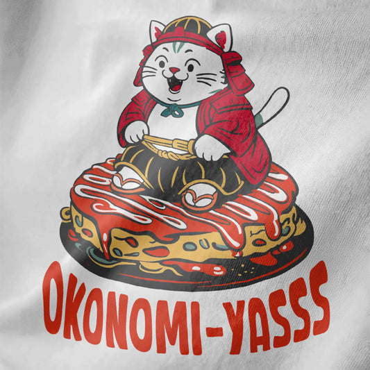 Playful samurai cat on okonomiyaki, white fabric close-up, with bold "OKONOMI-YASSS" text.