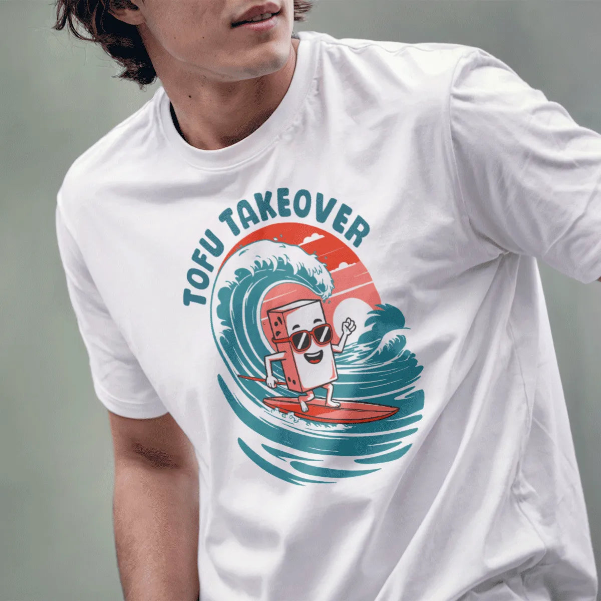Male model in white Japanese t-shirt with cartoon tofu surfing, red sunglasses, and “TOFU TAKEOVER” text.