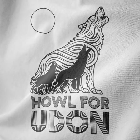 Close-up of white t-shirt with three howling wolves and udon noodle wolf, bold typography, contrast art.