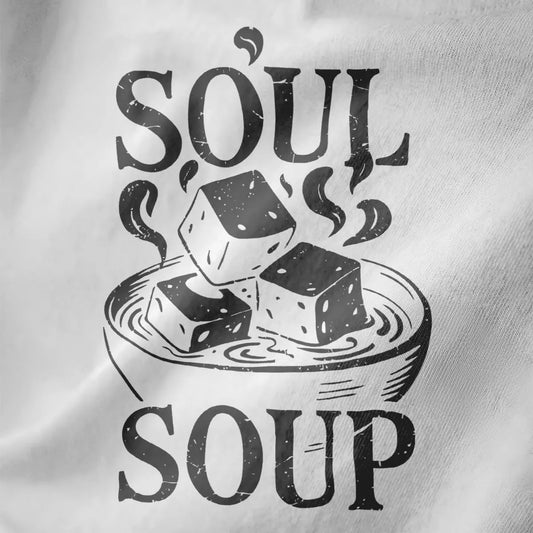 Minimalist miso soup bowl with tofu and "SOUL SOUP" text on white fabric, japanese t-shirts, cozy atmosphere.