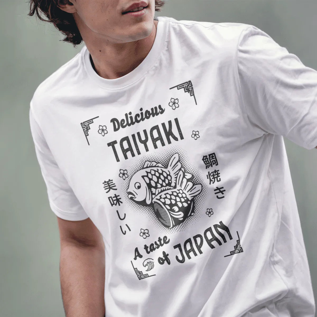 Male model in white tee with taiyaki graphic, English and Japanese text, japan tee shirts, symbolism japan.