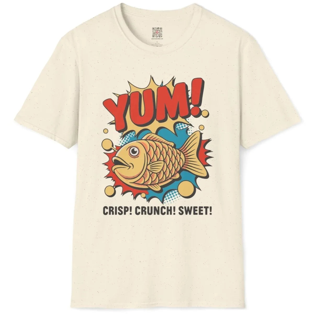 Natural t-shirt flatlay, taiyaki fish, "YUM!" and snack text, junk food shirt, cartoonish style.