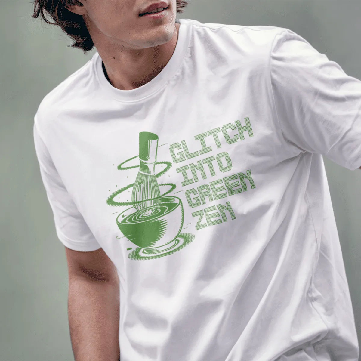 Male model in white t-shirt with matcha glitch art, bamboo whisk, and bold pixel font, graphic design t shirt.