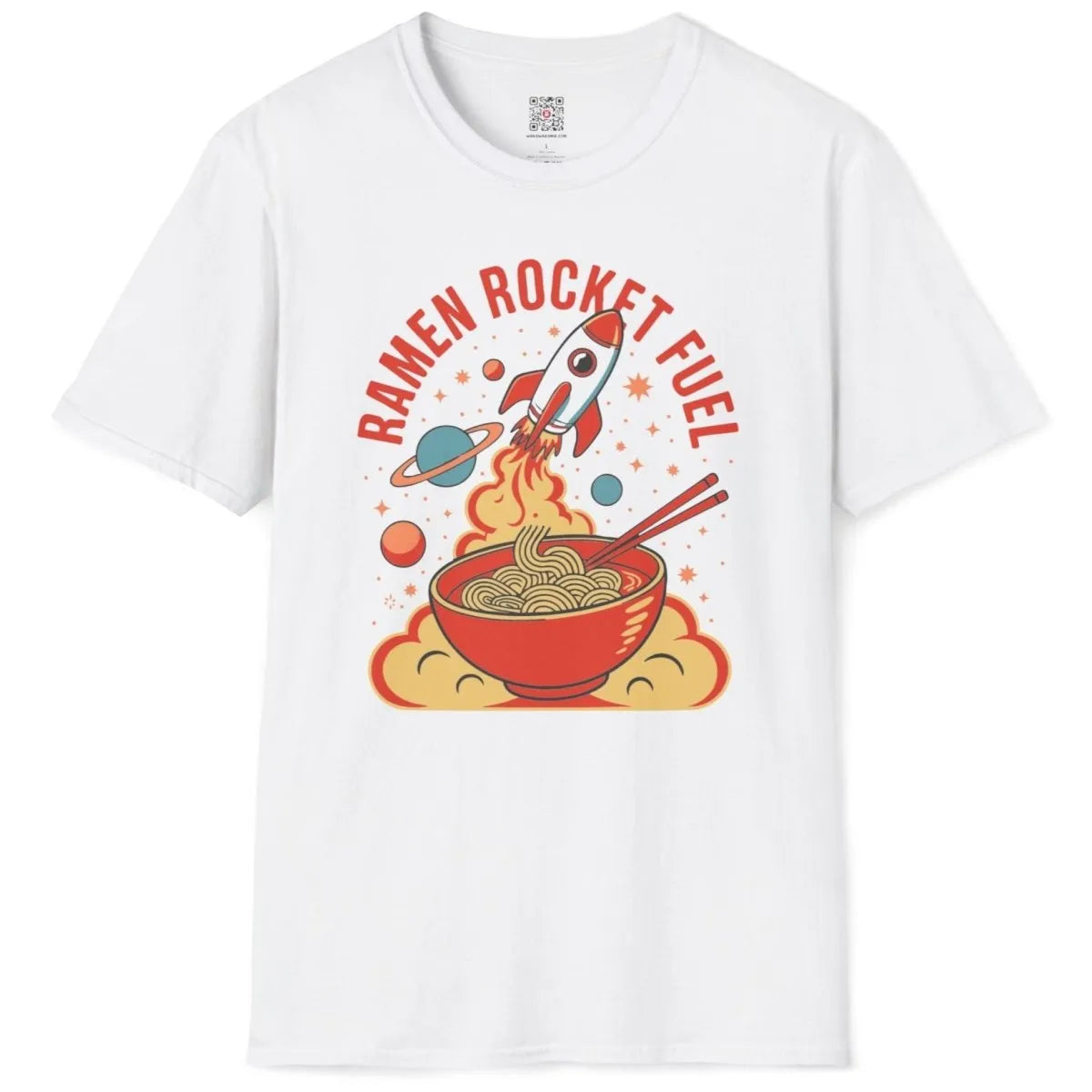 White t-shirt flatlay with colorful ramen, rocket launch, and bold retro font, cosmic design.