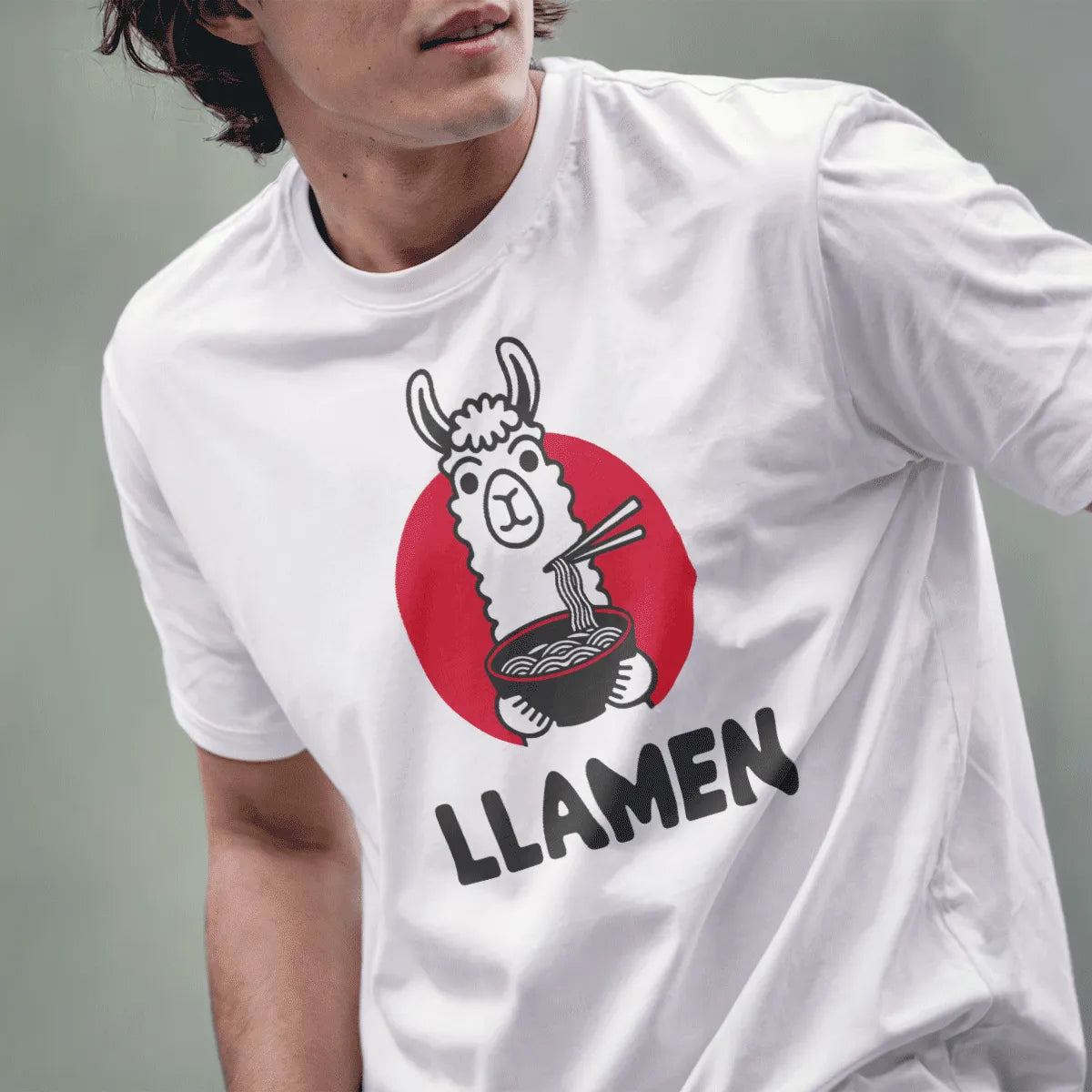 Male model wearing a white t-shirt with a cheerful cartoon llama and ramen bowl, minimalist font, foodie style.