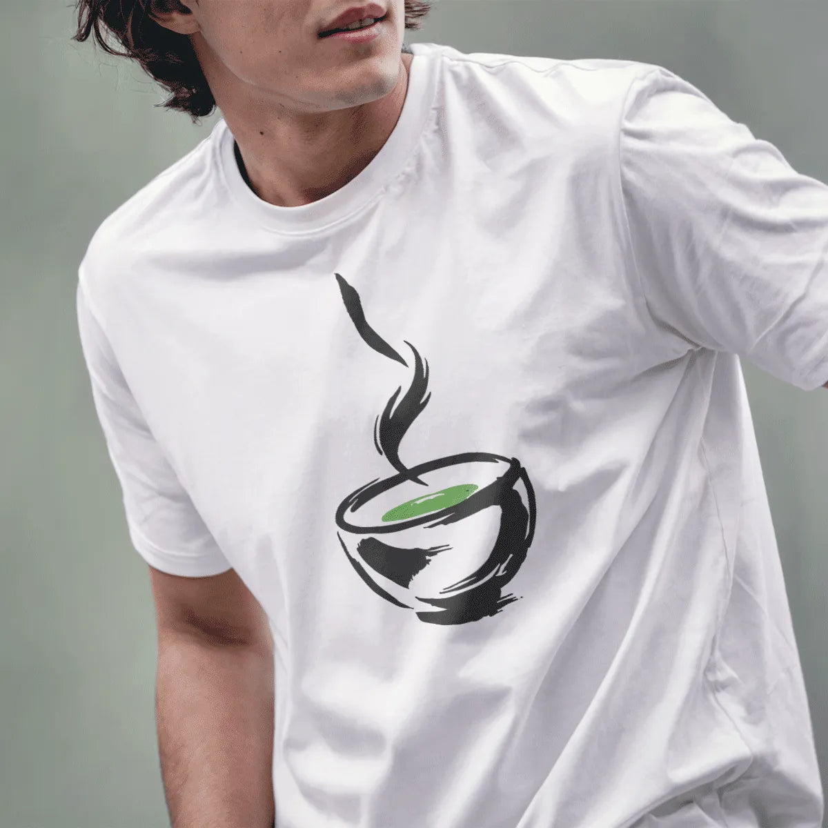 White t-shirt on male model with minimalist steaming bowl and green interior, calm design. modern tradition