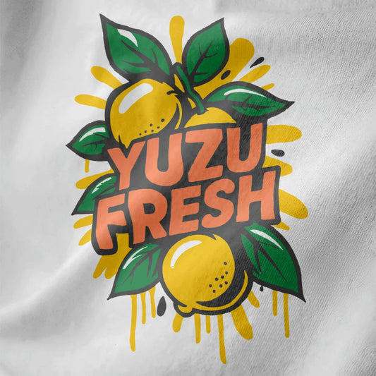 Close-up of "YUZU FRESH" design with bold yellow yuzu fruits on white fabric, vibrant style, japanese t-shirts.