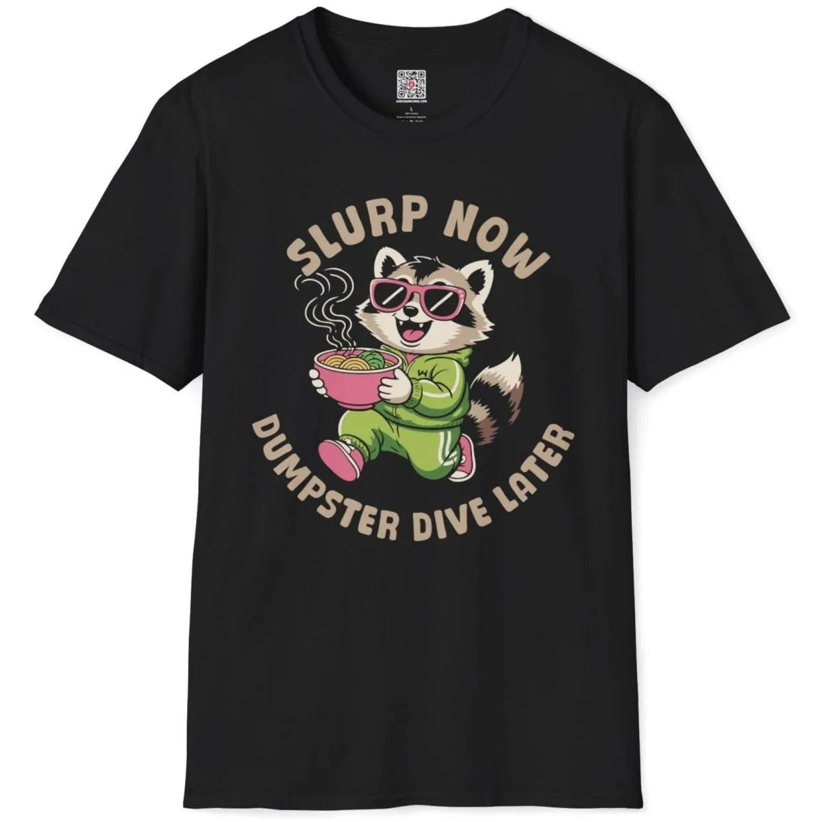 Black t-shirt flatlay with raccoon in tracksuit holding noodles, bold text, humorous quote, vibrant style.