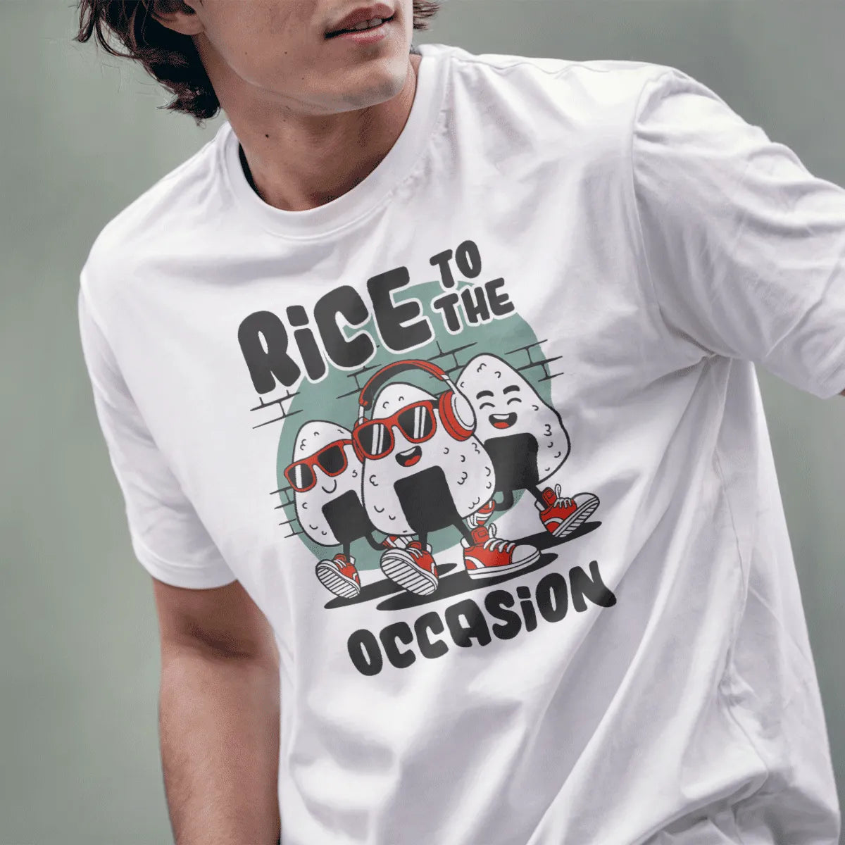 Male model in white t-shirt with cartoon onigiri, red headphones, bold typography, playful characters.