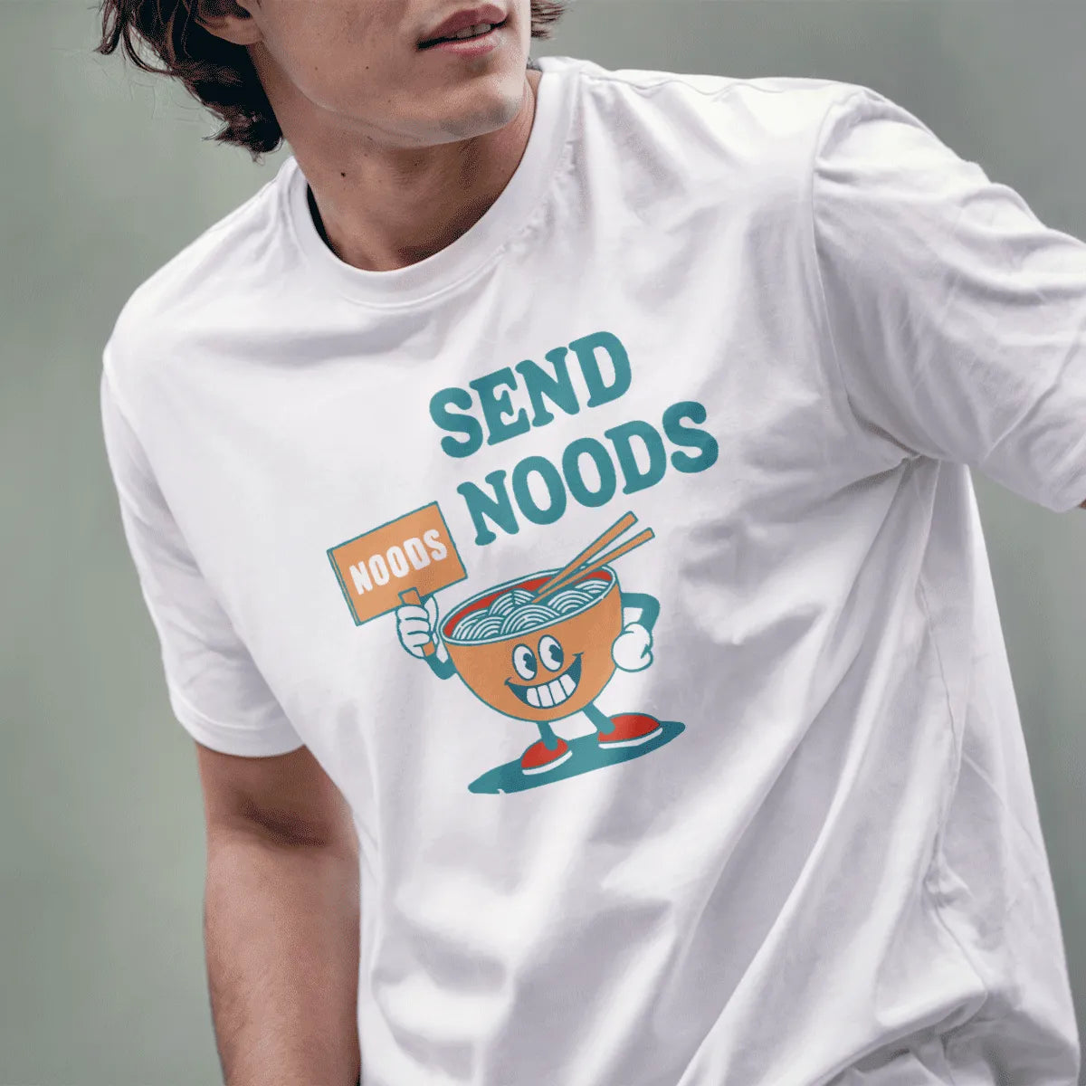 Male model in white t-shirt featuring cartoon noodle bowl and “SEND NOODS” text, funny shirts with sayings, noodle shirt.
