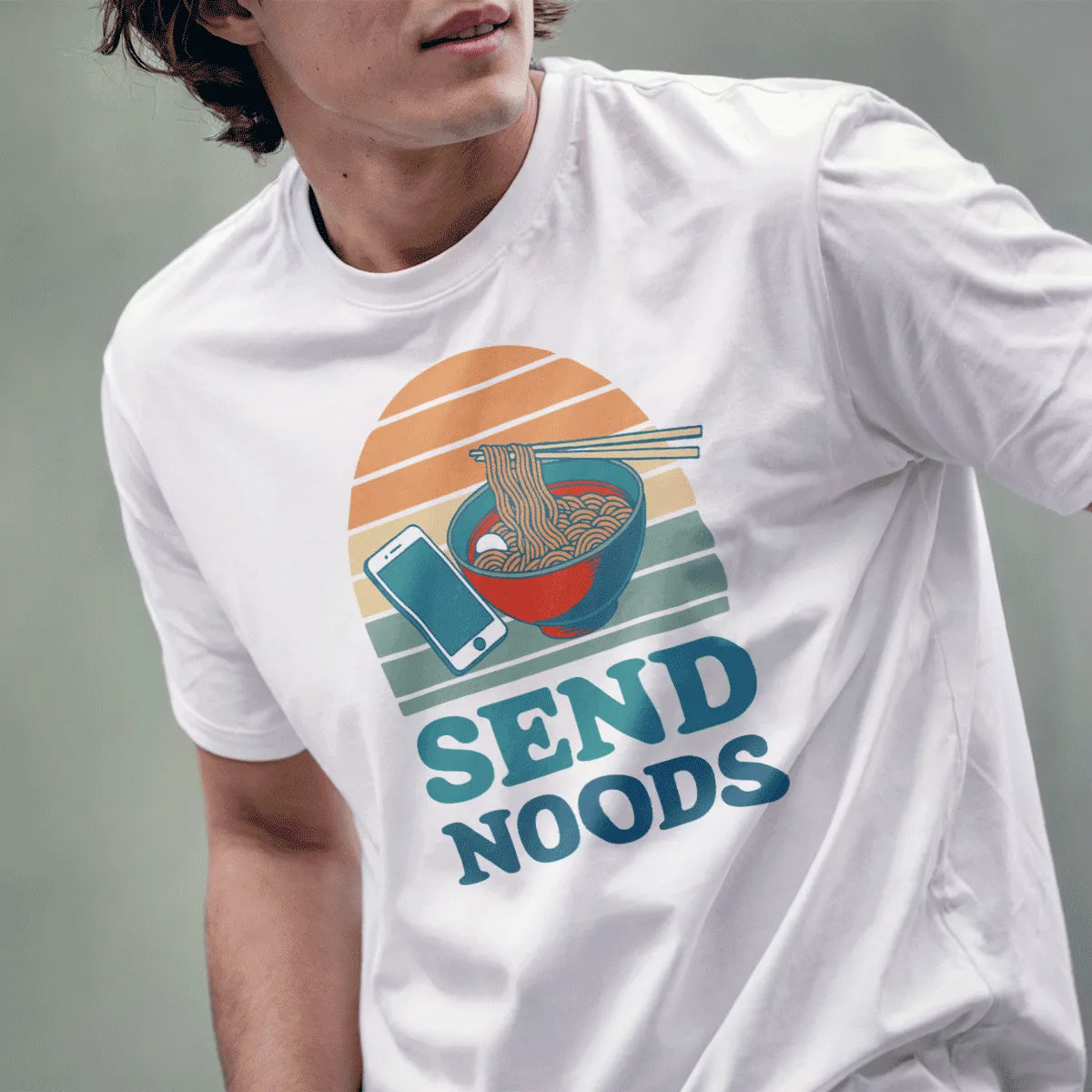 Male model in white t-shirt with ramen bowl, smartphone, retro sunset, “SEND NOODS” text. japanese t-shirts, humorous quote.