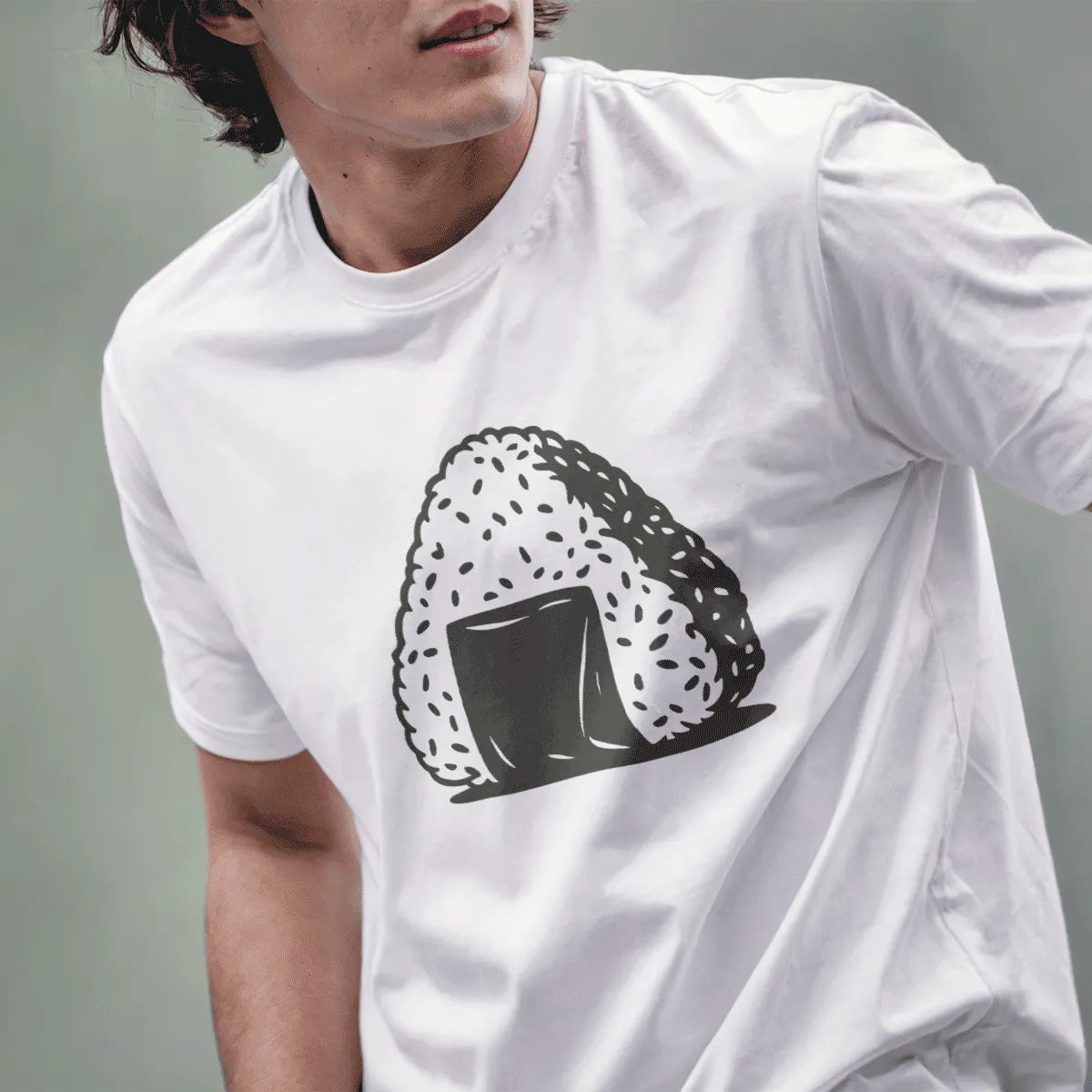 Male model in white t-shirt with playful onigiri rice ball graphic, japanese t-shirts, cultural identity.