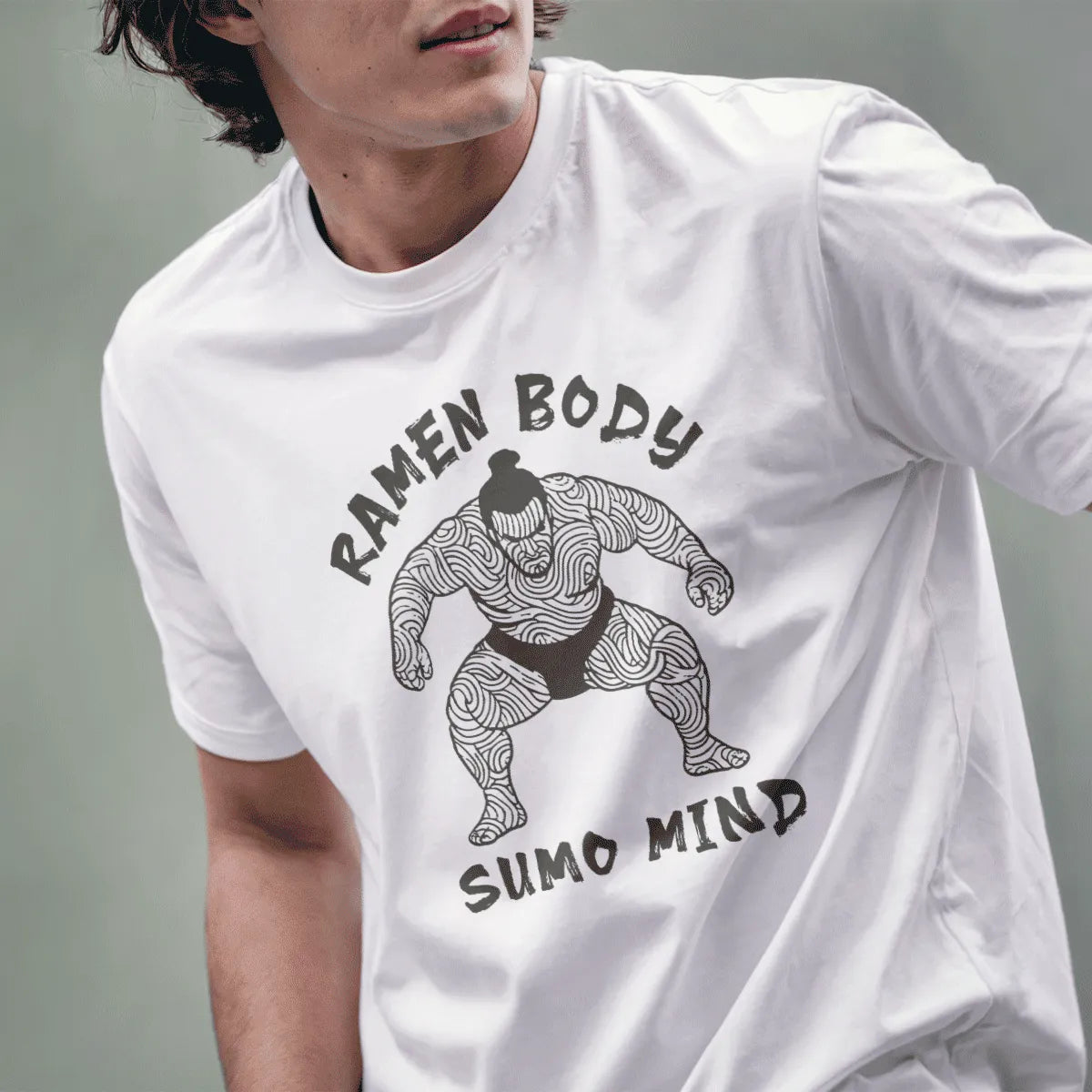Male model in white t-shirt with ramen noodle sumo design, ramen apparel, japanese t-shirts.