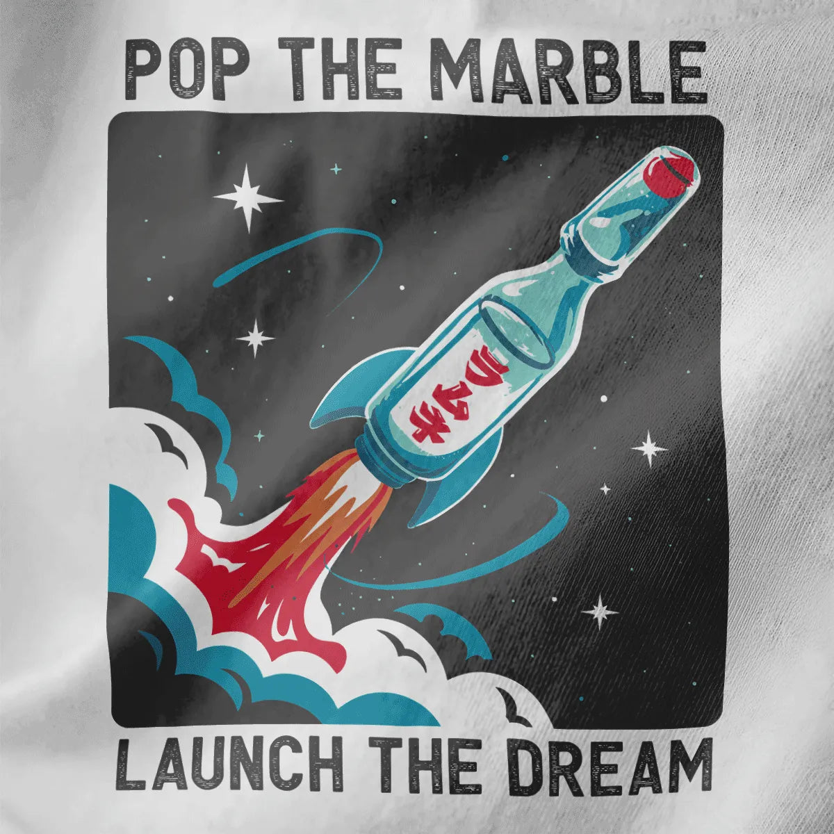 Close-up of white fabric featuring Ramune bottle rocket ship with iconic marble and star-speckled background.