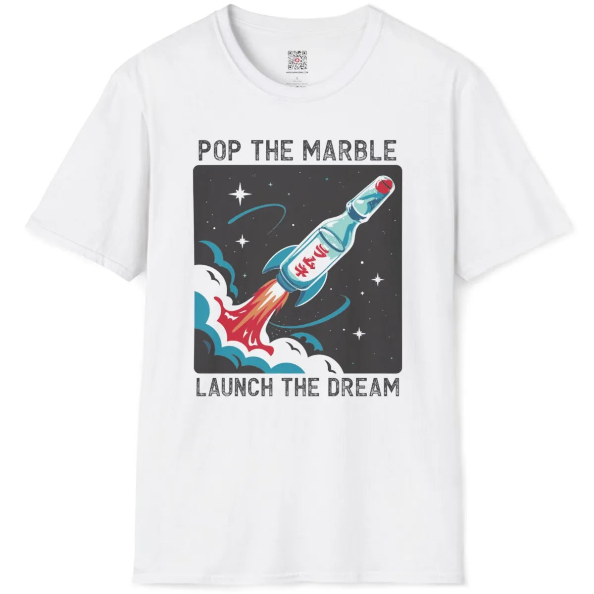 White t-shirt flatlay featuring cartoonish Ramune bottle transformed into energetic spacecraft with bold text.