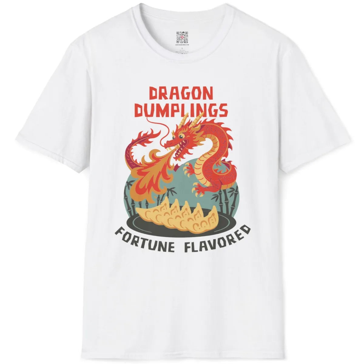 White t-shirt flatlay displaying fantasy dragon, plump gyoza, and bamboo accents in bold graphic style.