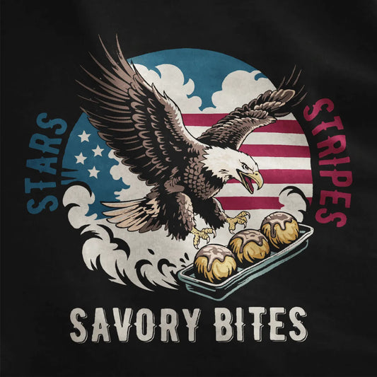 Black fabric close-up showing dynamic eagle with outstretched wings, golden takoyaki, and vintage stripes.