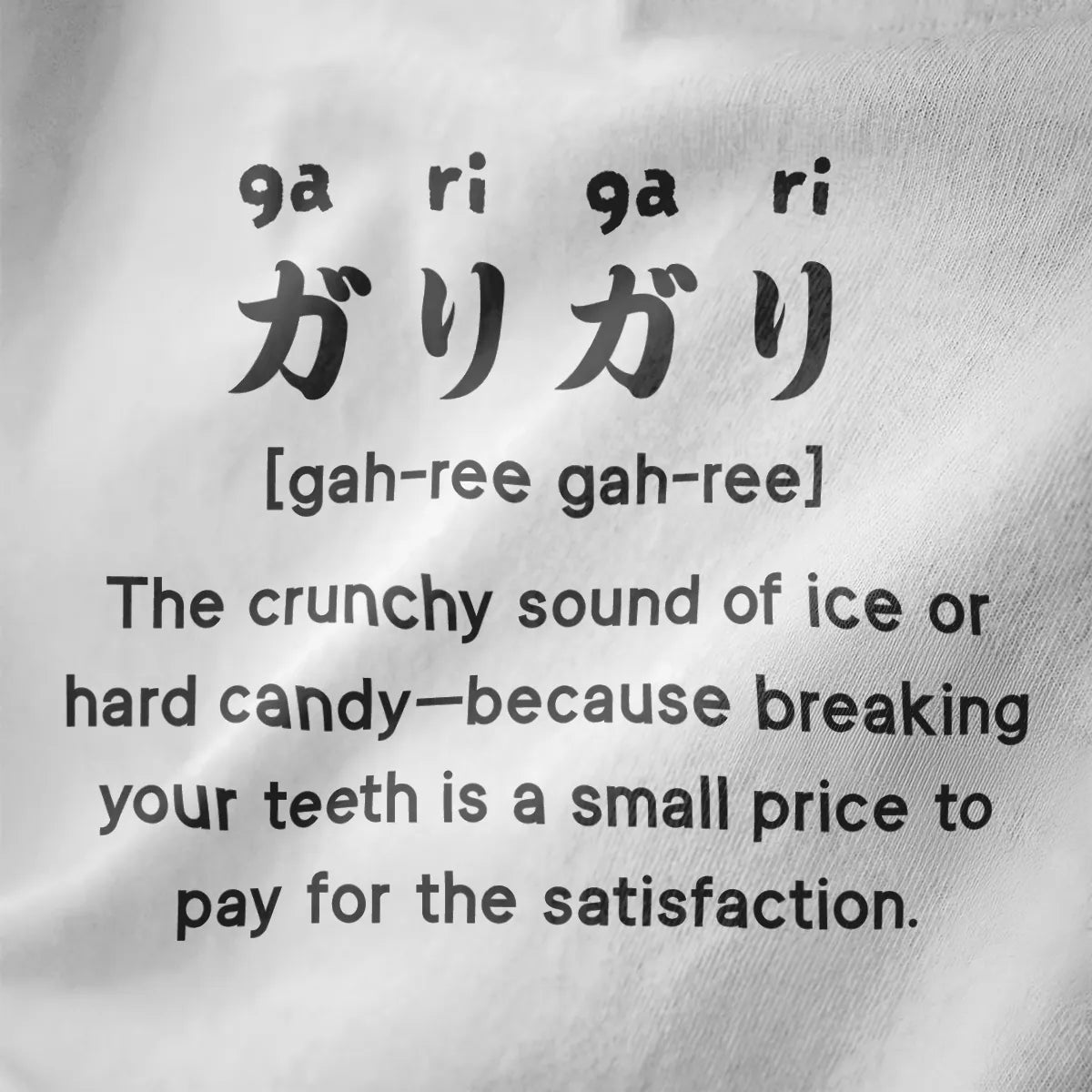 Bold black “gari-gari” Japanese text and playful caption on white fabric, quirky foodie style t shirt design graphic.
