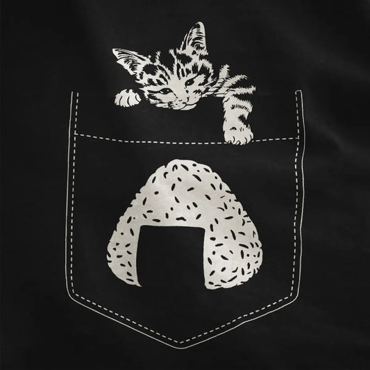 Black shirt close-up of expressive line art kitten over outlined pocket with onigiri, cozy and whimsical.
