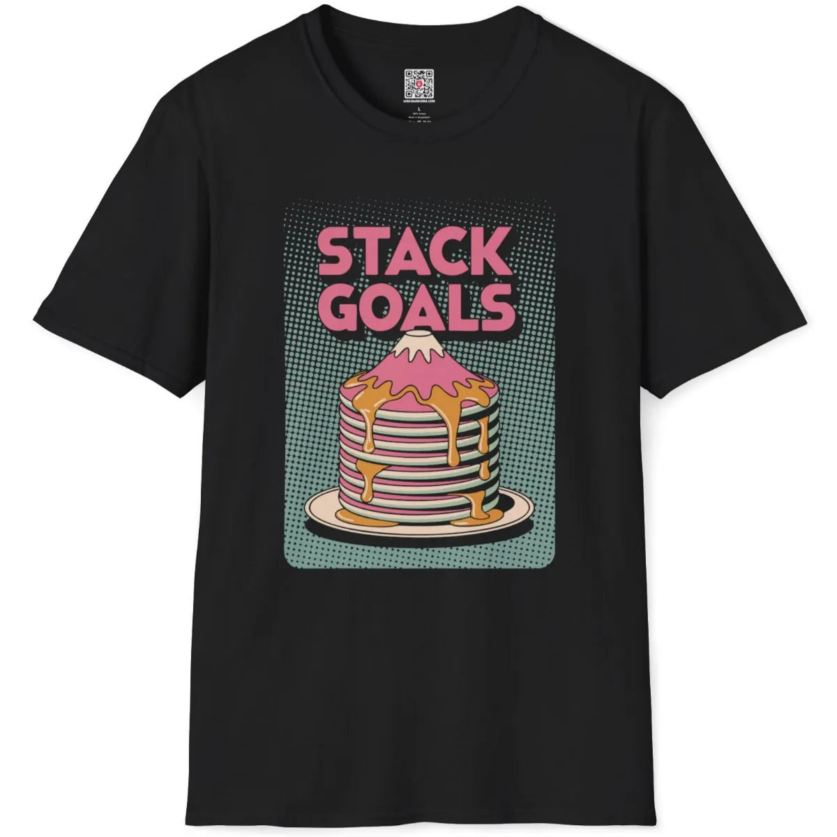 Black flatlay shirt featuring bold comic-style "STACK GOALS" and syrup-drizzled pink pancake stack Mount Fuji.
