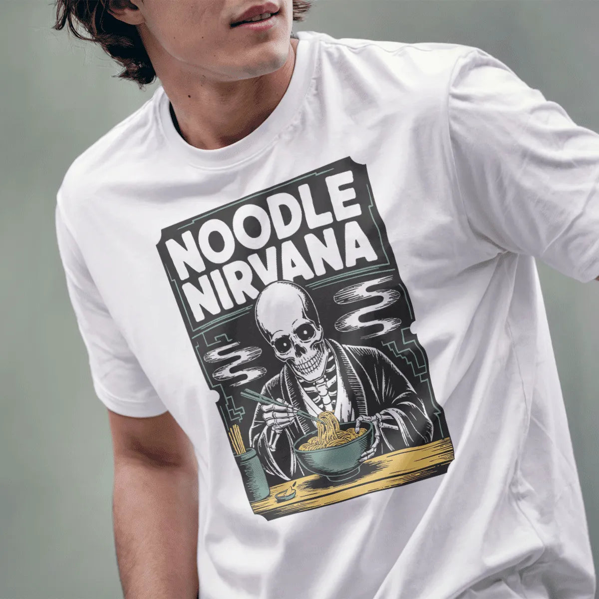 Male model wears white shirt featuring a whimsical skeleton enjoying ramen in gothic style.