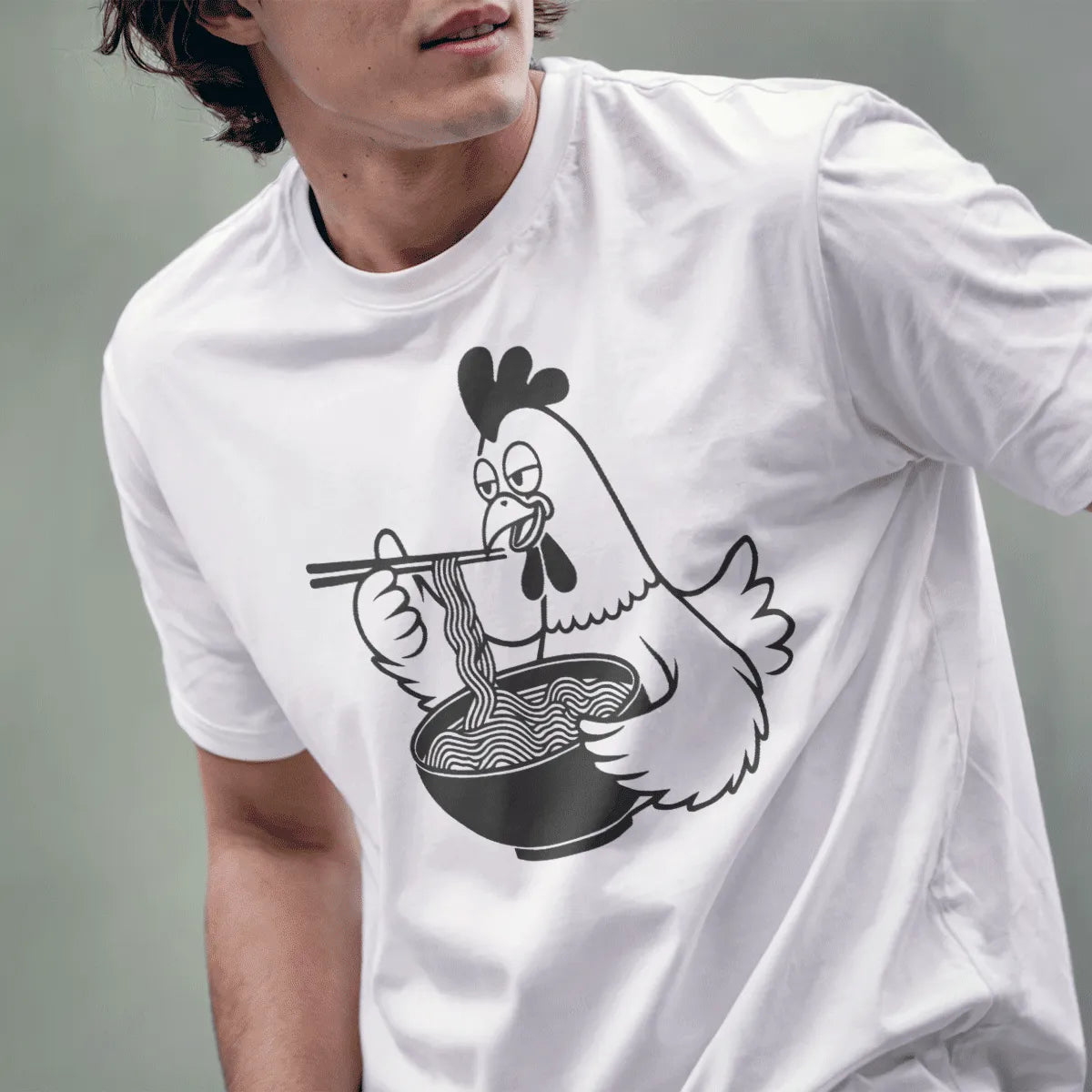 Male model in white shirt with cartoon chicken, noodles, chopsticks. ramen t-shirt, junk food shirt, umami noodles