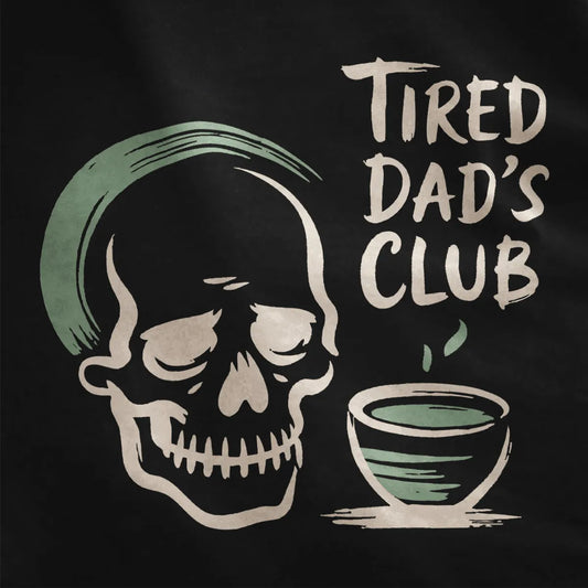 Black fabric close-up showing tired dad skull and steaming matcha bowl, soft palette, casual dad shirt.