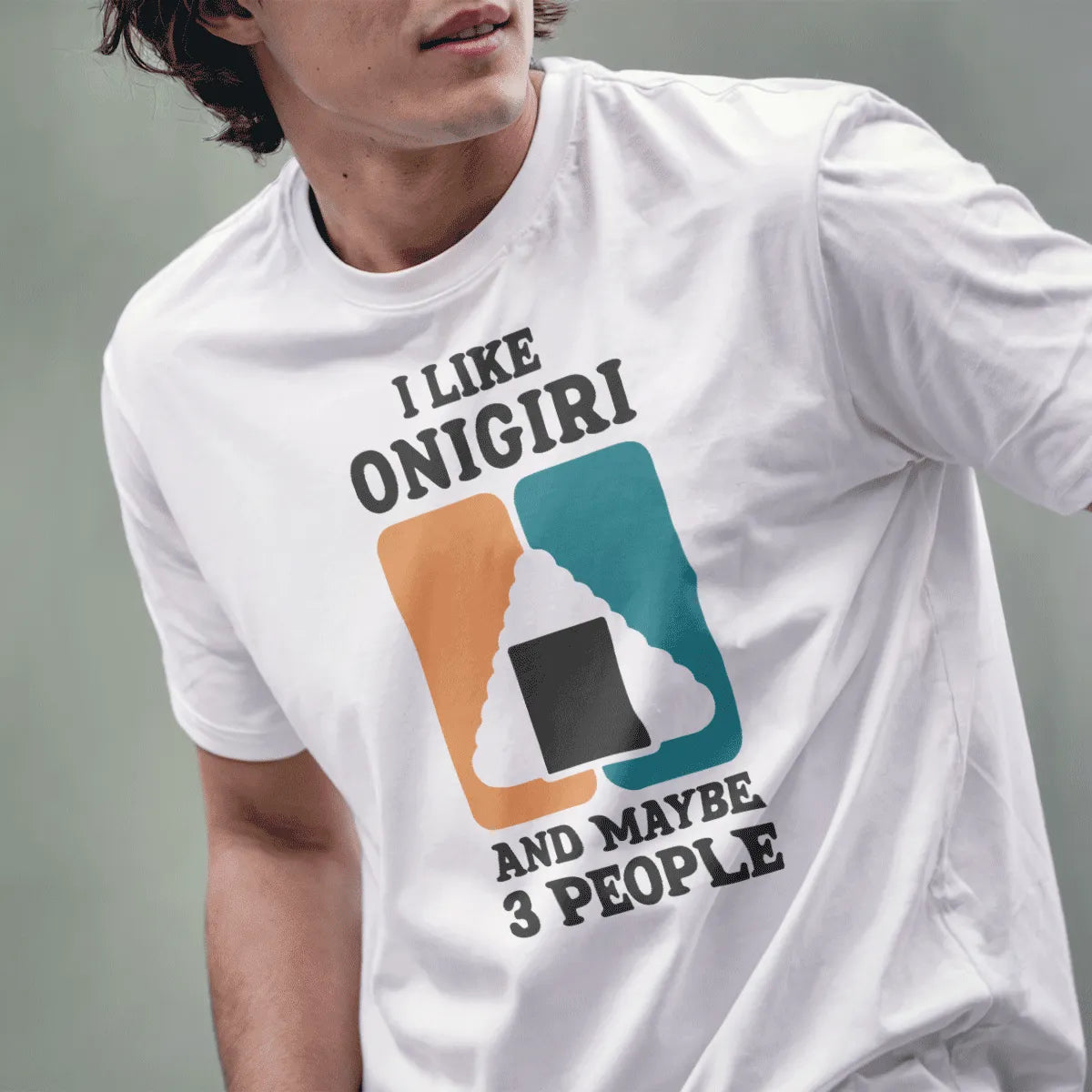 Male model in white tee with "I LIKE ONIGIRI" and colorful rice ball illustration, humorous quote, sushi culture.