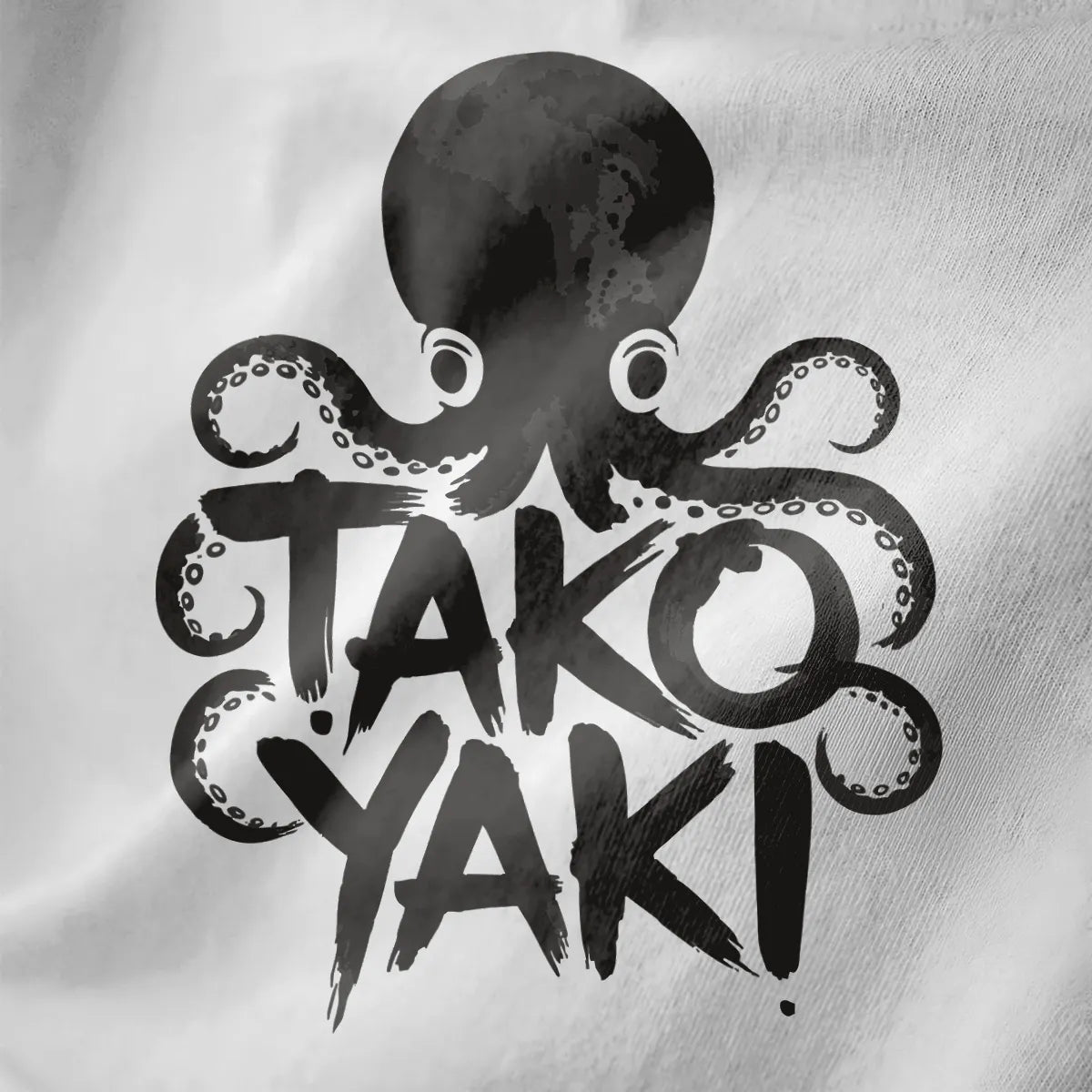 Watercolor style octopus with takoyaki text on white fabric close-up, playful octopus art, brushstroke.