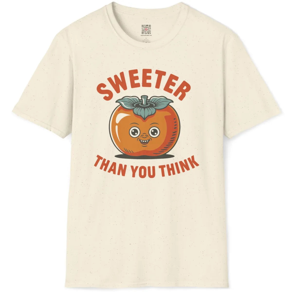 Natural color tee flatlay featuring retro persimmon character with orange tones and teal leaf crown, playful quote.