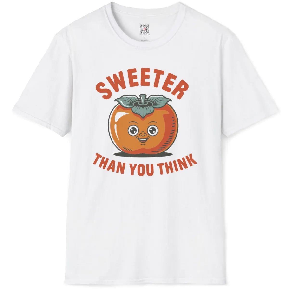 White flatlay t-shirt showing cheerful persimmon face with bold retro text, orange and teal color palette.