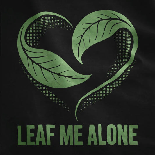 Black fabric close-up features retro heart-leaf motif and playful text, vintage aesthetic, nature blend.