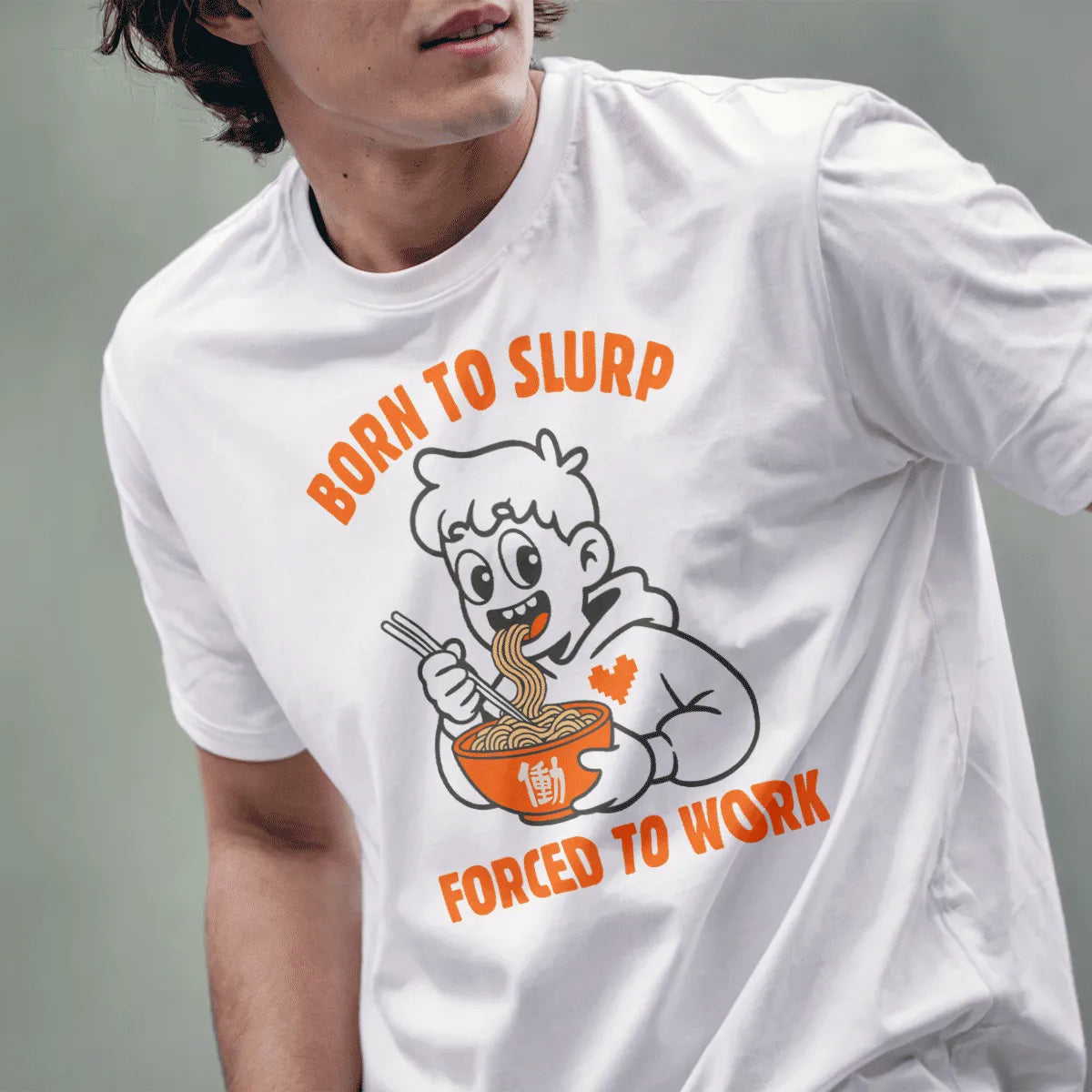 Male model wearing white tee with playful ramen slurping cartoon and pixel heart hoodie design.