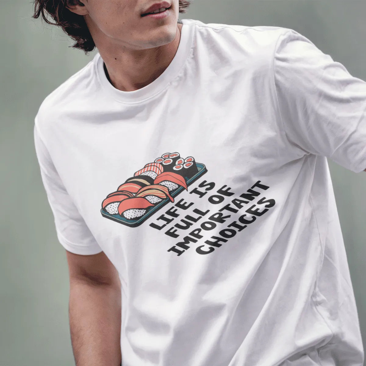 Male model in white tee with detailed sushi plate and bold motivational phrase; sushi t-shirt, positive messaging.