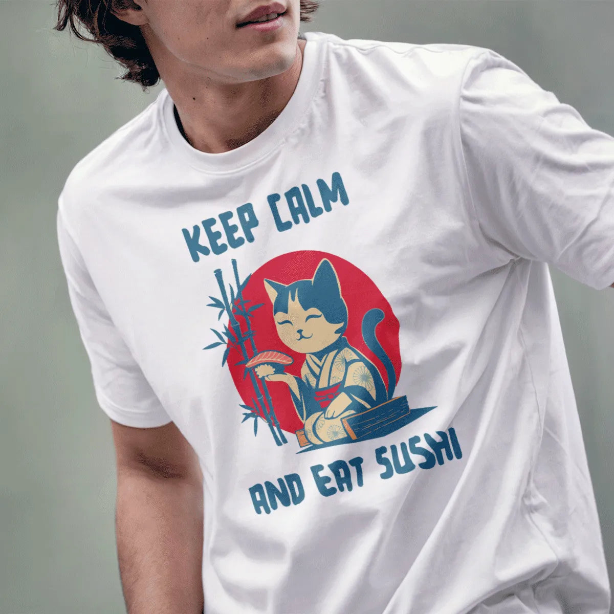 Male model in white t-shirt featuring a cute kimono cat with sushi, Japanese flag motif, and bamboo.